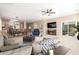 Inviting living room with plush seating, a ceiling fan, and an open floor plan at 29051 N Shannon Dr, San Tan Valley, AZ 85143