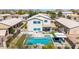 An aerial view of a beautiful pool with a spa and a covered outdoor kitchen and seating area at 29051 N Shannon Dr, San Tan Valley, AZ 85143