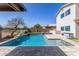Sparkling pool with a raised spa, waterfall feature, and a fenced yard at 29051 N Shannon Dr, San Tan Valley, AZ 85143