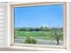 Window view overlooking green golf course with neighborhood houses at 29051 N Shannon Dr, San Tan Valley, AZ 85143