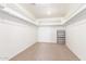 Walk-in closet featuring neutral carpet, shelving, and plenty of space at 29051 N Shannon Dr, San Tan Valley, AZ 85143