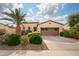 Charming single-story home featuring a well-maintained desert landscape and a two-car garage at 29624 N 128Th Ln, Peoria, AZ 85383
