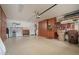 Spacious garage with epoxy floors, built-in cabinets, and lots of storage space at 29624 N 128Th Ln, Peoria, AZ 85383