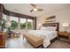 Comfortable main bedroom with large windows that offer a lovely outside view at 29624 N 128Th Ln, Peoria, AZ 85383