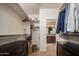 Walk-in closet featuring custom organizers and plenty of room for clothing and storage at 29624 N 128Th Ln, Peoria, AZ 85383