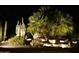 Night view of backyard water feature with lighted desert landscaping at 29624 N 128Th Ln, Peoria, AZ 85383