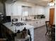 Well-lit kitchen with white cabinets, updated countertops and modern appliances, a chef's delight at 3141 W Joan De Arc Ave, Phoenix, AZ 85029
