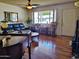Welcoming living room with wood floors, a piano and bright lighting at 3141 W Joan De Arc Ave, Phoenix, AZ 85029