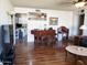 Spacious living room featuring hardwood floors, a piano, and ample space for relaxation at 3141 W Joan De Arc Ave, Phoenix, AZ 85029
