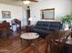Cozy living room with hardwood floors, comfortable seating, and natural light at 3141 W Joan De Arc Ave, Phoenix, AZ 85029