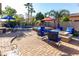 Outdoor patio with fire pit, seating, hot tub, and barbecue area perfect for entertaining at 3150 E Isaiah Ave, Gilbert, AZ 85298