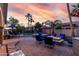 Outdoor oasis with fire pit and poolside seating perfect for relaxing and entertaining at 3150 E Isaiah Ave, Gilbert, AZ 85298