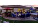 Backyard patio with built-in bar, fire pit, hot tub, and ample seating for entertaining guests at 3150 E Isaiah Ave, Gilbert, AZ 85298