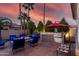 Outdoor oasis with built-in grill, fire pit, and seating area perfect for entertaining at 3150 E Isaiah Ave, Gilbert, AZ 85298
