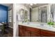 Bathroom boasts a double sink vanity with dark wood cabinets and neutral walls at 3150 E Isaiah Ave, Gilbert, AZ 85298