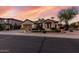 Charming single-story home with a well-manicured lawn and a spacious two-car garage at 3150 E Isaiah Ave, Gilbert, AZ 85298