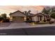 Charming single-story home with a well-manicured lawn and a spacious two-car garage at 3150 E Isaiah Ave, Gilbert, AZ 85298