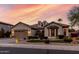 Charming single-story home with a well-manicured lawn and a spacious two-car garage at 3150 E Isaiah Ave, Gilbert, AZ 85298