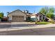 Charming single-story home with a well-manicured lawn and a spacious two-car garage at 3150 E Isaiah Ave, Gilbert, AZ 85298