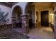 Inviting front porch with stone pillars and seating area at 3150 E Isaiah Ave, Gilbert, AZ 85298
