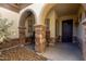 Inviting front porch with stone pillars and seating area at 3150 E Isaiah Ave, Gilbert, AZ 85298