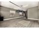 Spacious garage featuring epoxy flooring, storage racks, and ample room for vehicles at 3150 E Isaiah Ave, Gilbert, AZ 85298