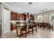 Spacious kitchen with granite countertops, stainless steel appliances, and a breakfast bar with seating at 3150 E Isaiah Ave, Gilbert, AZ 85298