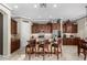 Well-equipped kitchen with granite countertops, stainless steel appliances, and island with breakfast bar seating at 3150 E Isaiah Ave, Gilbert, AZ 85298
