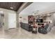 The expansive living room features a ceiling fan, fireplace and neutral walls for a relaxing atmosphere at 3150 E Isaiah Ave, Gilbert, AZ 85298