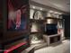 Stylish living room with stone fireplace, floating shelves, and a modern entertainment unit at 3150 E Isaiah Ave, Gilbert, AZ 85298
