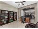 The office features built-in bookshelves, a ceiling fan, and an open layout for flexible use at 3150 E Isaiah Ave, Gilbert, AZ 85298