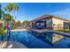 Pool with volleyball net with seating near the house with covered patio at 3150 E Isaiah Ave, Gilbert, AZ 85298