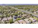 Beautiful aerial shot of a home in a well-maintained, verdant neighborhood with pools at 3252 E Lexington Ave, Gilbert, AZ 85234