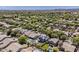 Stunning aerial showing houses with lush landscaping, private pools, and solar panels at 3252 E Lexington Ave, Gilbert, AZ 85234