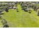 Picturesque aerial view of a well-maintained park with a playground and expansive green lawns for recreation at 3252 E Lexington Ave, Gilbert, AZ 85234
