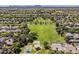 Wide aerial perspective of a community park with playground, green fields, and surrounding residential area at 3252 E Lexington Ave, Gilbert, AZ 85234