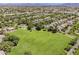 Expansive aerial view showcasing lush green space and the surrounding community at 3252 E Lexington Ave, Gilbert, AZ 85234