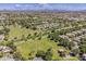 Panoramic aerial shot highlighting a large community park nestled among tree-lined streets and homes at 3252 E Lexington Ave, Gilbert, AZ 85234