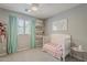 Charming Bedroom with a white crib, soft lighting, and adorable decor at 3252 E Lexington Ave, Gilbert, AZ 85234