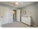 Bedroom featuring white dresser, neutral walls, and two doors offering hallway and closet access at 3252 E Lexington Ave, Gilbert, AZ 85234