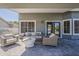 Comfortable covered patio features cozy seating and neutral colors, creating a welcoming outdoor space at 3252 E Lexington Ave, Gilbert, AZ 85234