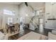 Open concept living and dining room space with vaulted ceilings and wood flooring at 3252 E Lexington Ave, Gilbert, AZ 85234