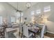 Tastefully decorated dining area with lots of natural light and view of the living room at 3252 E Lexington Ave, Gilbert, AZ 85234