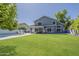 Backyard view of a home with large windows, patio, and a pool is perfect for relaxing or entertaining at 3252 E Lexington Ave, Gilbert, AZ 85234