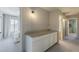 Hallway with cabinets and views into the bedrooms and bathrooms, creating a connected living space at 3252 E Lexington Ave, Gilbert, AZ 85234