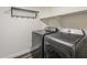 Practical laundry area with front-load washer and dryer, providing efficient space and streamlined design at 3252 E Lexington Ave, Gilbert, AZ 85234