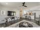 Open-concept living room offers dark wood look floors and leads into the kitchen at 3252 E Lexington Ave, Gilbert, AZ 85234