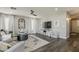 Spacious living room with modern furnishings, neutral decor and dark wood look floors at 3252 E Lexington Ave, Gilbert, AZ 85234