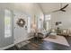 Inviting living room featuring vaulted ceilings, neutral paint, wood floors, and large windows at 3252 E Lexington Ave, Gilbert, AZ 85234
