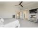 Spacious main bedroom featuring a ceiling fan, recessed lighting, and views of the ensuite bathroom and walk in closet at 3252 E Lexington Ave, Gilbert, AZ 85234
